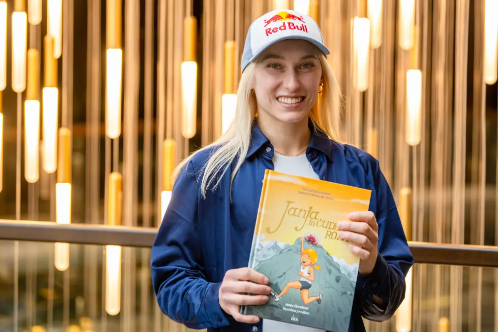 Sport climber Janja Garnbret holds a picture book inspired by her life story. Photo: Tamino Petelinšek/STA